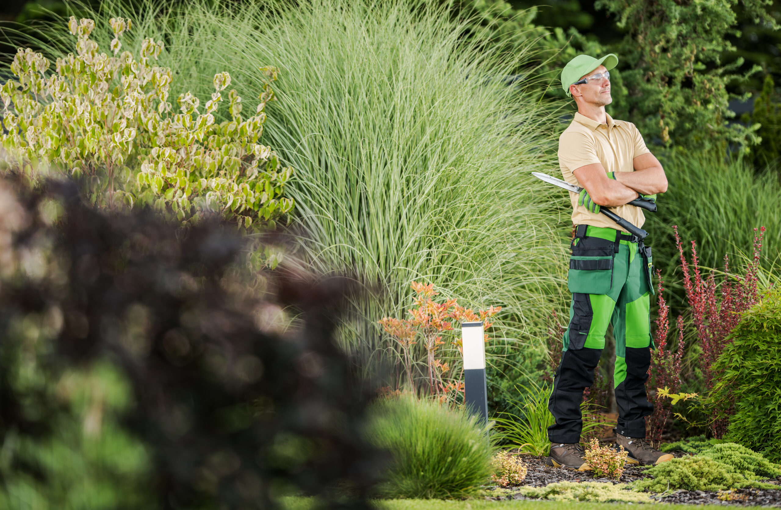 Professional Garden Worker with Pro Scissors in His Hands